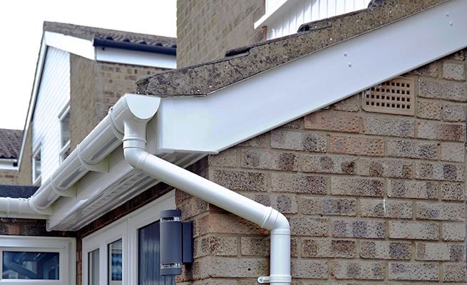 Whole house rooftrim renovation including White uPVC guttering downpipes soffits and fascias